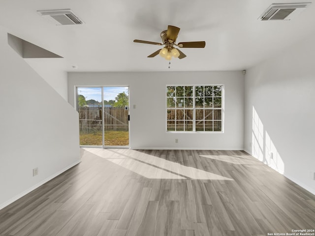 spare room featuring light hardwood / wood-style floors and ceiling fan