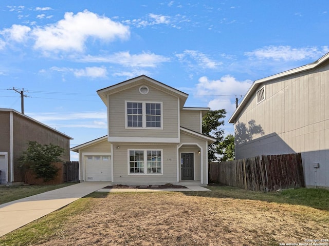 front of property featuring a garage and a front lawn