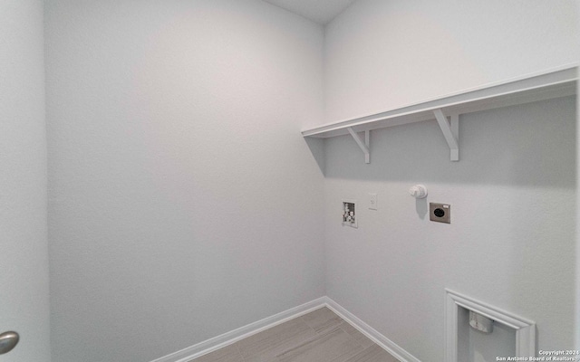 laundry room featuring laundry area, baseboards, hookup for a gas dryer, hookup for a washing machine, and electric dryer hookup