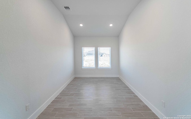 unfurnished room featuring light wood-style flooring, recessed lighting, baseboards, and visible vents