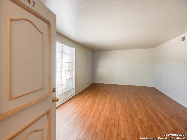 spare room with light wood-type flooring