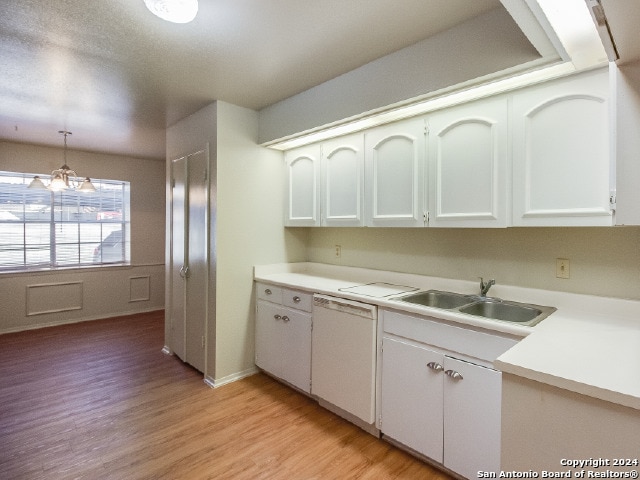 kitchen with pendant lighting, dishwasher, light hardwood / wood-style floors, white cabinetry, and a chandelier