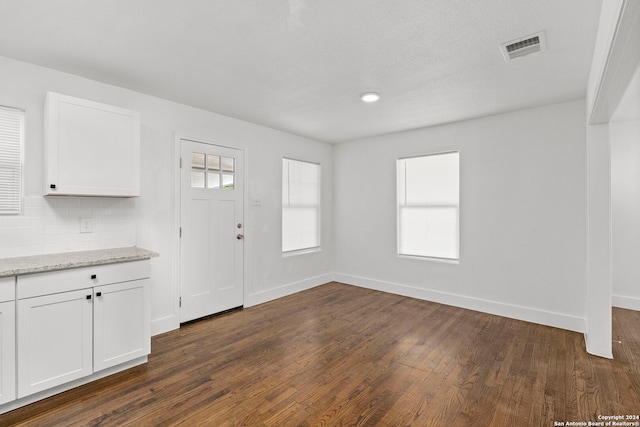 foyer entrance with dark hardwood / wood-style flooring