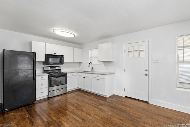 kitchen featuring black appliances, sink, tasteful backsplash, dark hardwood / wood-style flooring, and white cabinetry