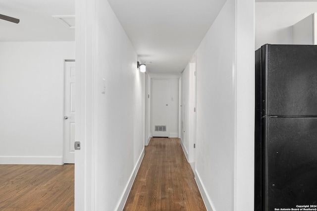 hallway with wood-type flooring