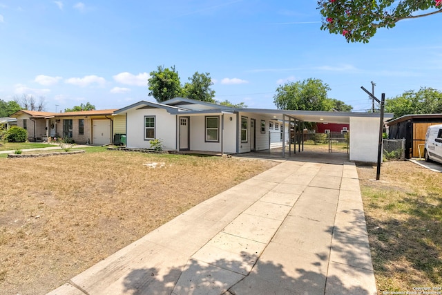 ranch-style house featuring a carport