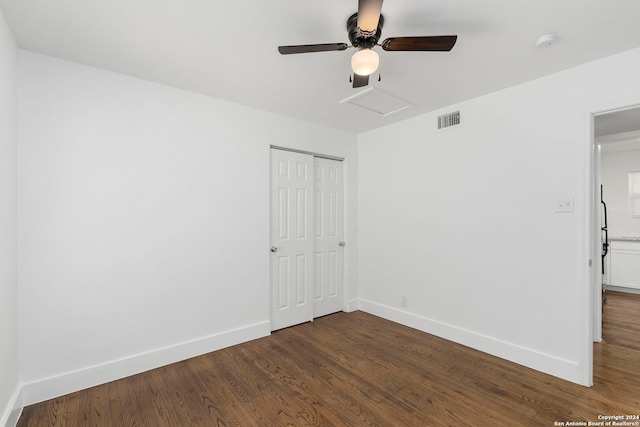 spare room with ceiling fan and dark hardwood / wood-style flooring