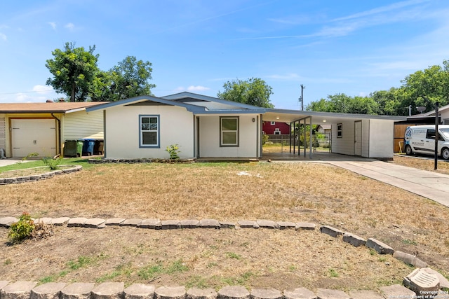 ranch-style house featuring a carport