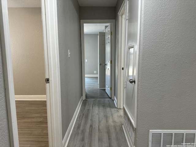 hallway featuring light hardwood / wood-style floors