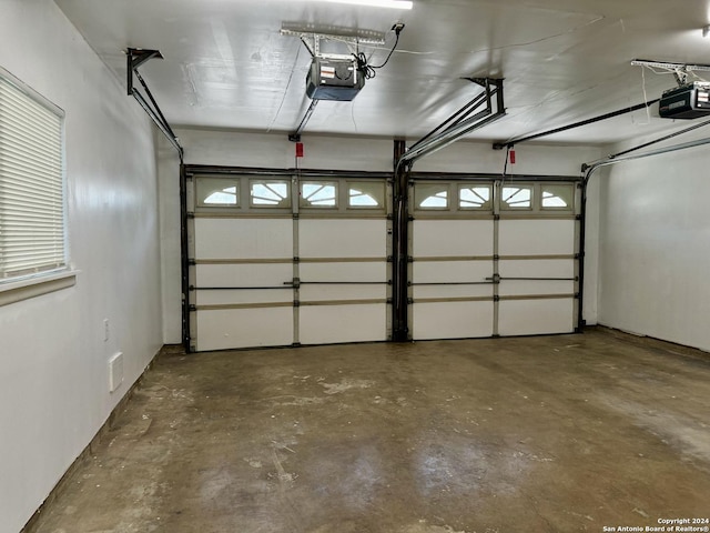 garage featuring a garage door opener