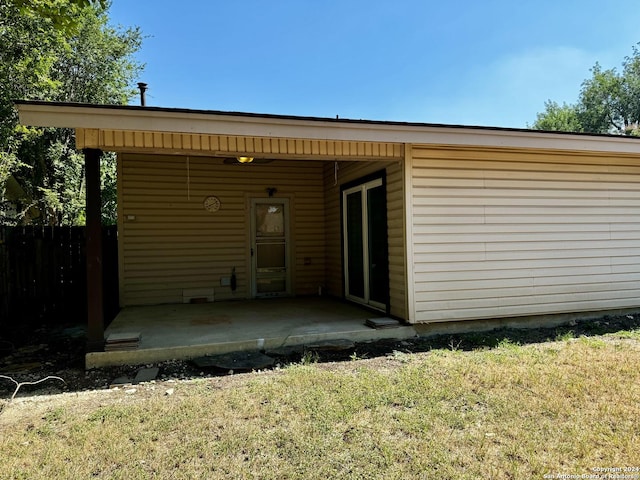 back of house with a patio