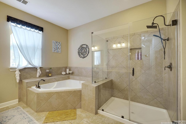 bathroom with plenty of natural light, independent shower and bath, and tile patterned flooring