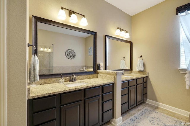 bathroom with tile patterned flooring and vanity