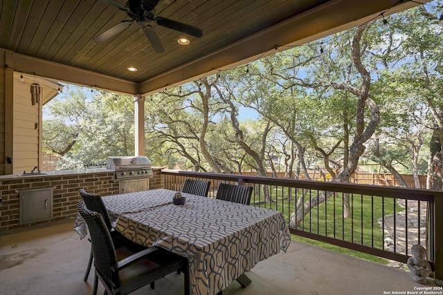 view of patio with ceiling fan and a grill