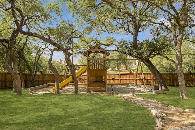 view of jungle gym with a lawn