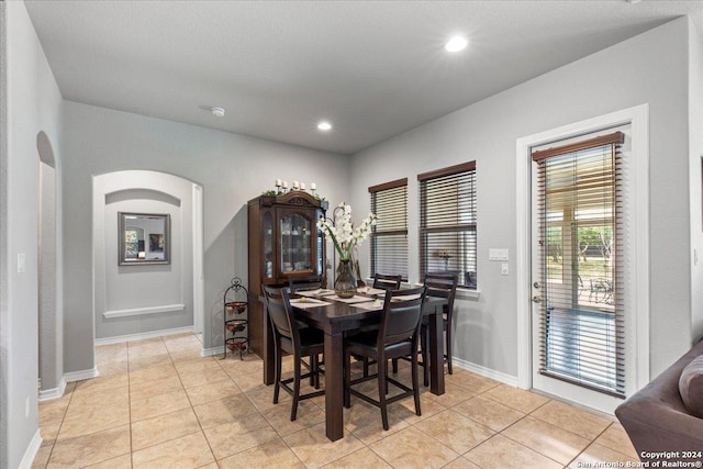 dining area featuring light tile patterned floors