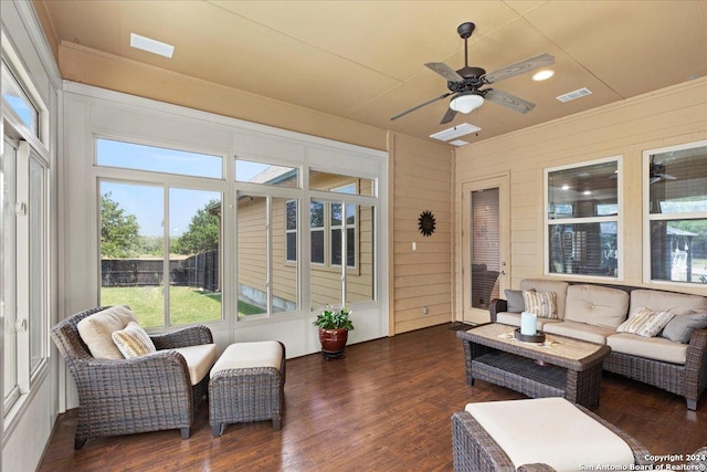 sunroom / solarium featuring ceiling fan