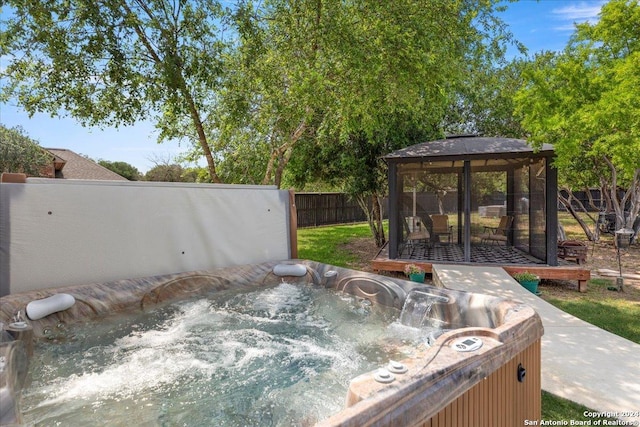 view of patio / terrace with a gazebo and a hot tub