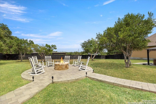 view of yard with a patio area and an outdoor fire pit