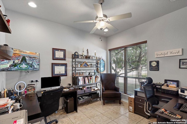 tiled office space featuring ceiling fan