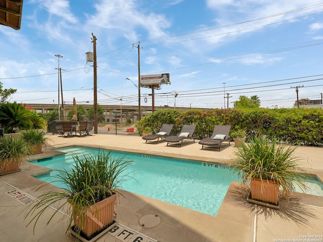 view of pool featuring a patio