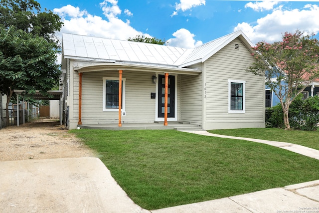 view of front of property with a front yard and a porch