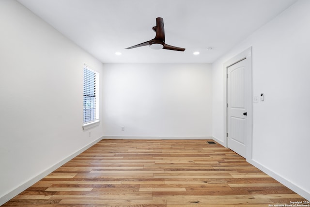 unfurnished room featuring ceiling fan and light hardwood / wood-style flooring