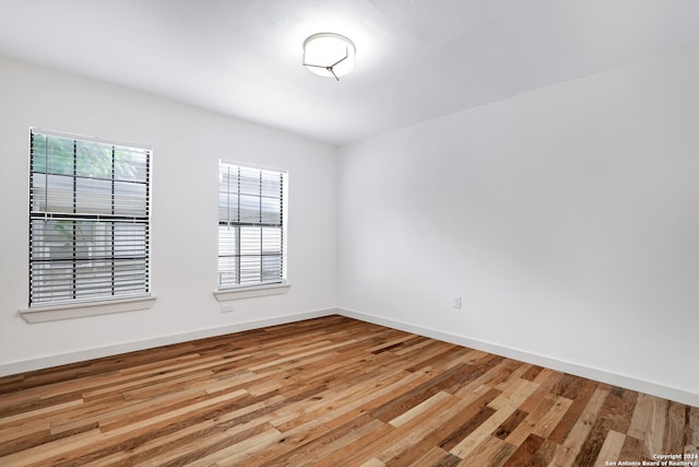 spare room featuring light wood-type flooring