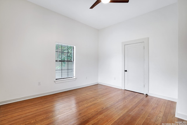 unfurnished room with ceiling fan and light wood-type flooring