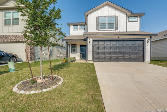 view of front of home featuring a garage and a front yard