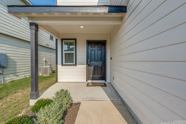 entrance to property featuring central AC unit