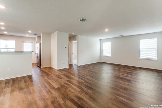 unfurnished room featuring dark hardwood / wood-style floors