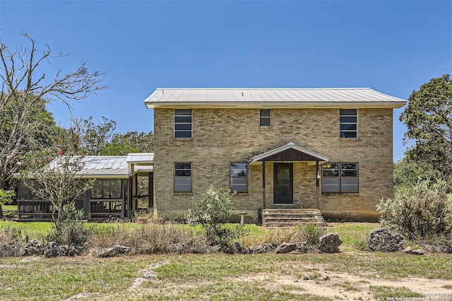 view of front facade featuring a sunroom