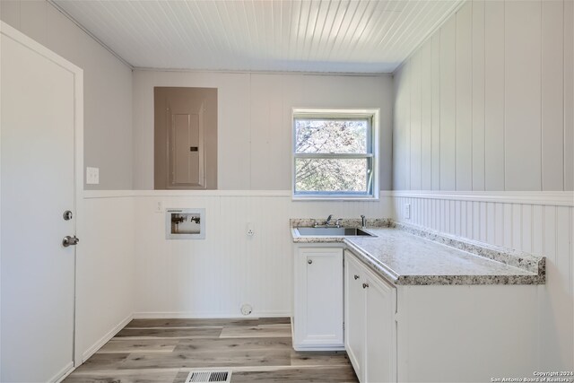 bathroom with walk in shower, wood-type flooring, toilet, wooden walls, and vanity