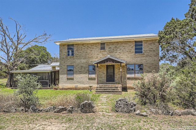 view of front facade featuring a sunroom