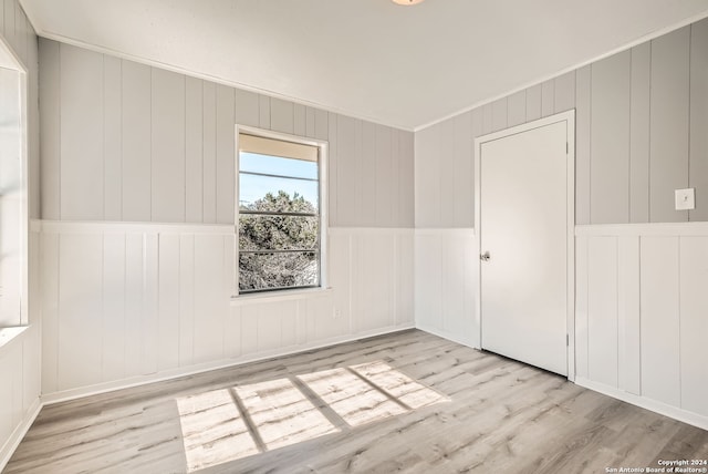 spare room featuring light hardwood / wood-style floors