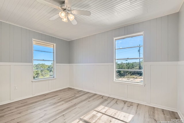 spare room with ceiling fan and light hardwood / wood-style floors