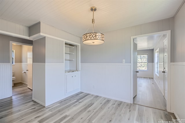 unfurnished dining area featuring light hardwood / wood-style floors