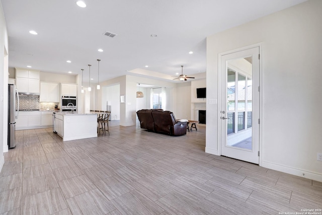 living room with ceiling fan