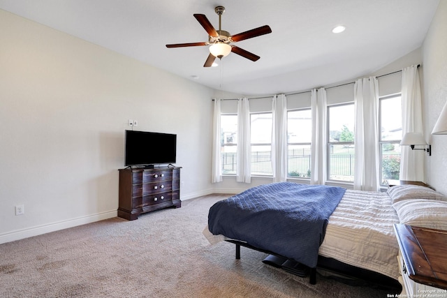 bedroom with ceiling fan and light carpet