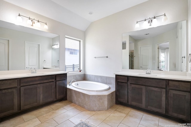 bathroom featuring tile patterned flooring, vanity, vaulted ceiling, and independent shower and bath