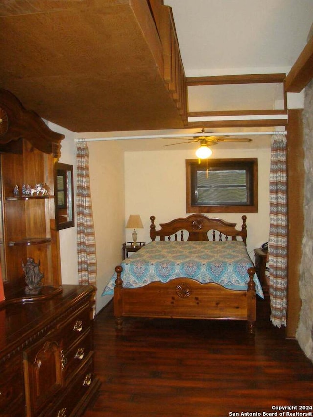 bedroom with dark wood-type flooring