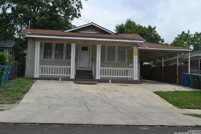 view of front of house featuring a carport and a porch