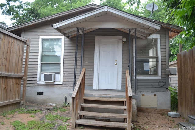 doorway to property featuring cooling unit