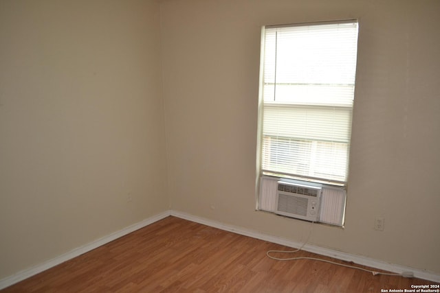 empty room with wood-type flooring