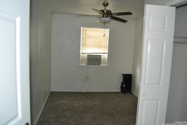 unfurnished room featuring ceiling fan, cooling unit, and dark carpet