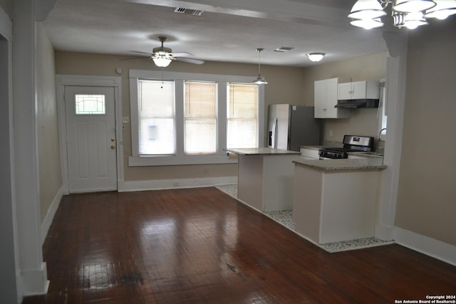 kitchen with appliances with stainless steel finishes, light stone counters, dark wood-type flooring, decorative light fixtures, and white cabinetry