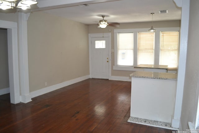 entryway with ceiling fan and dark hardwood / wood-style flooring