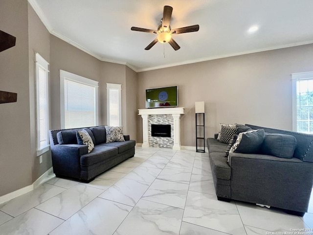 living room featuring a stone fireplace, ceiling fan, and ornamental molding