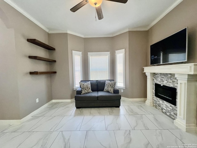 living room featuring crown molding, a fireplace, and ceiling fan